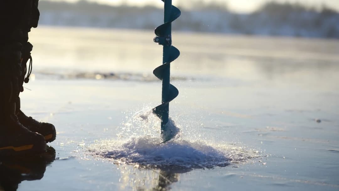 Eisangeln | Picture of Ice Fishing in Finland – Winter Adventures on Frozen Lakes